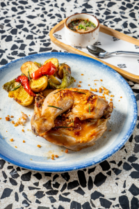 Roasted half Chicken: Fried garlic & Shallots, Jeaw Sauce with Bell peppers, baby potatoes & Rosemary