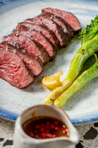 AUS Black Angus Hanger Steak: Four peppercorn sauce, broccolini