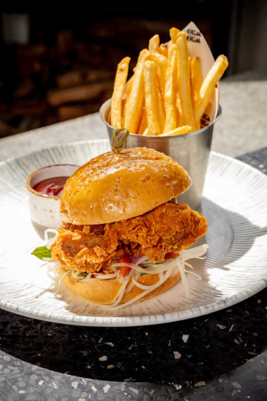 Fried Chili Chicken Burgers: Chicken thigh, green papaya slaw, peanut satay sauce, sesame seed brioche bun