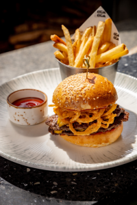 Chim Chim Smash Burger: Australian black angus beef patty, American cheese, onions, Chim Chim special sauce, sesame seed brioche bun