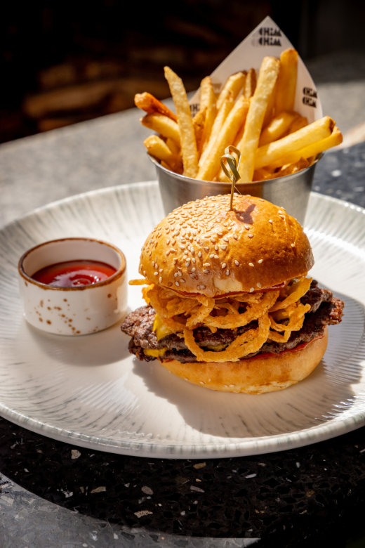 Chim Chim Smash Burger: Australian black angus beef patty, American cheese, onions, Chim Chim special sauce, sesame seed brioche bun